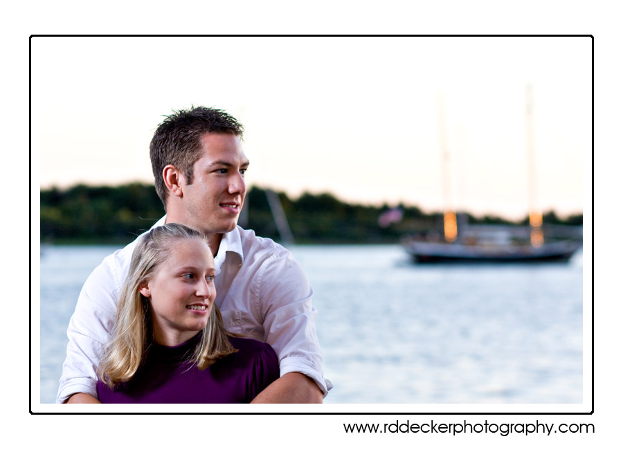 Sail boats at anchor along the Beaufort Waterfront adds extra romance to Crystal Coast engagement photos.